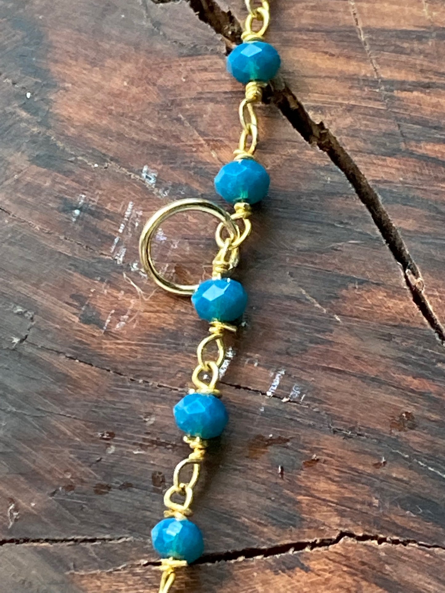 Hair charm dangle made of tanzanite beads with gold deer charm