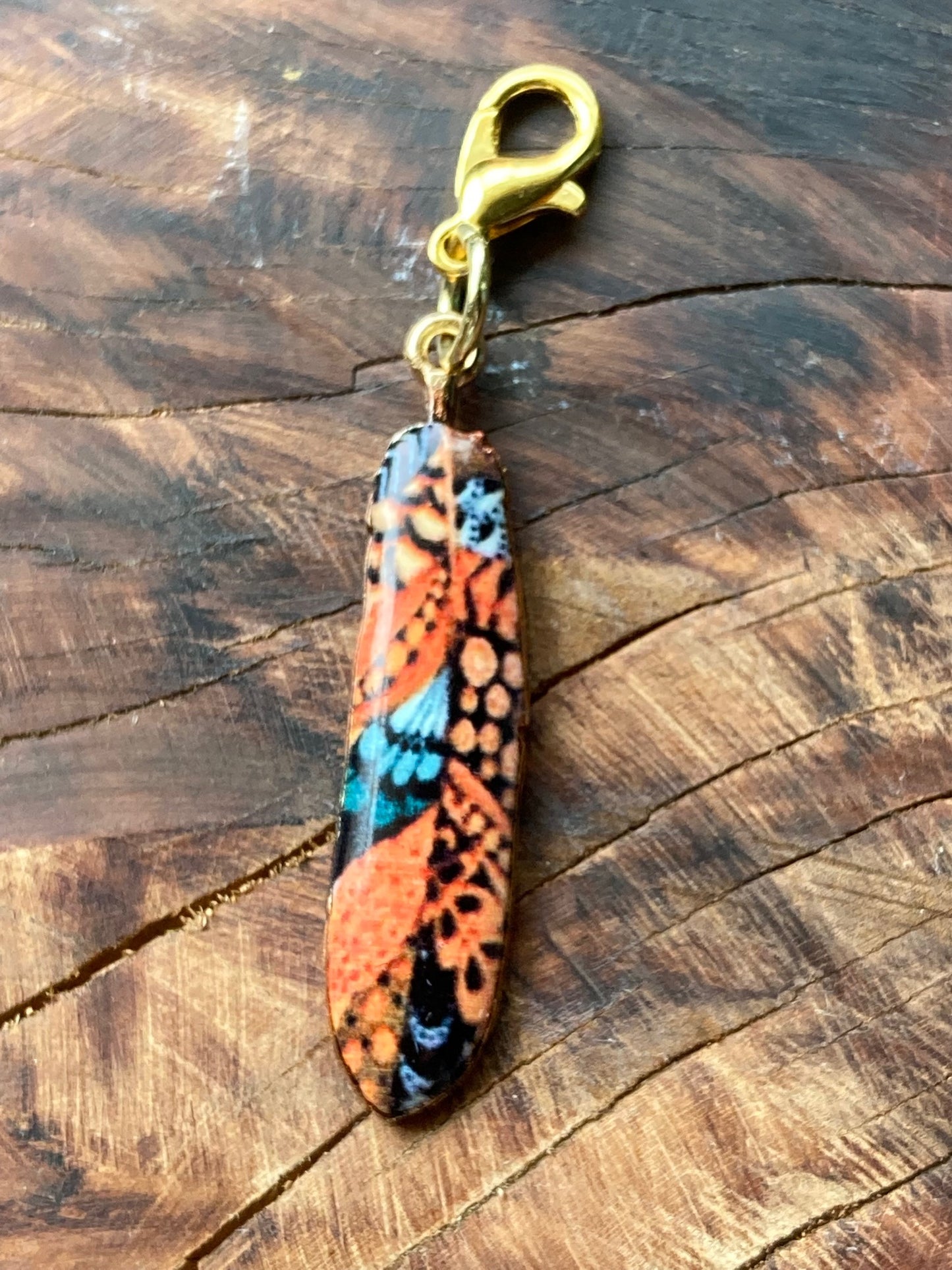 Charm, Artistic enamel feather