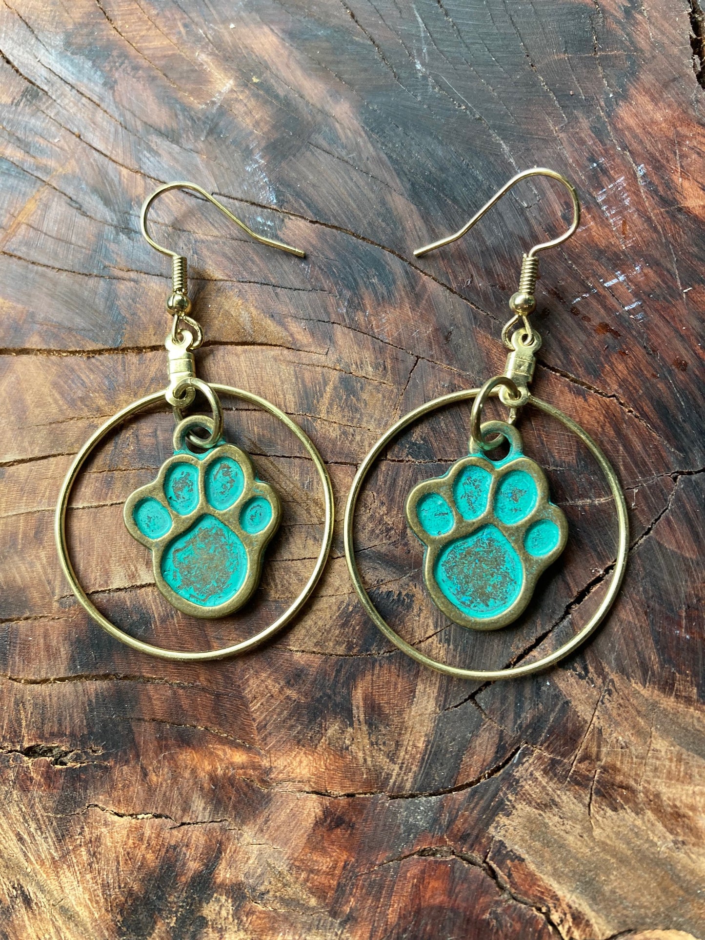 Gold circle paw print earrings