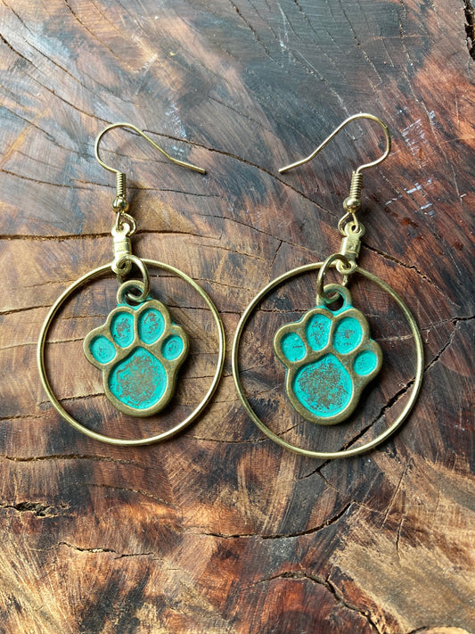 Gold circle paw print earrings
