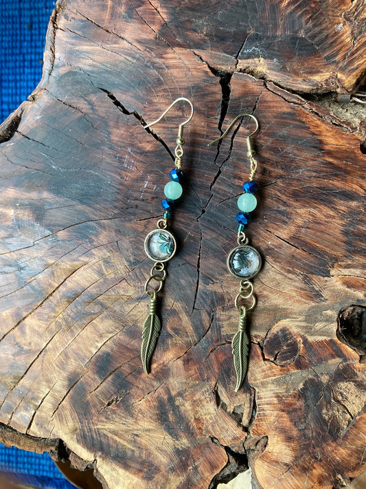 Dangling bronze feathers with unique hand crafted bead earrings