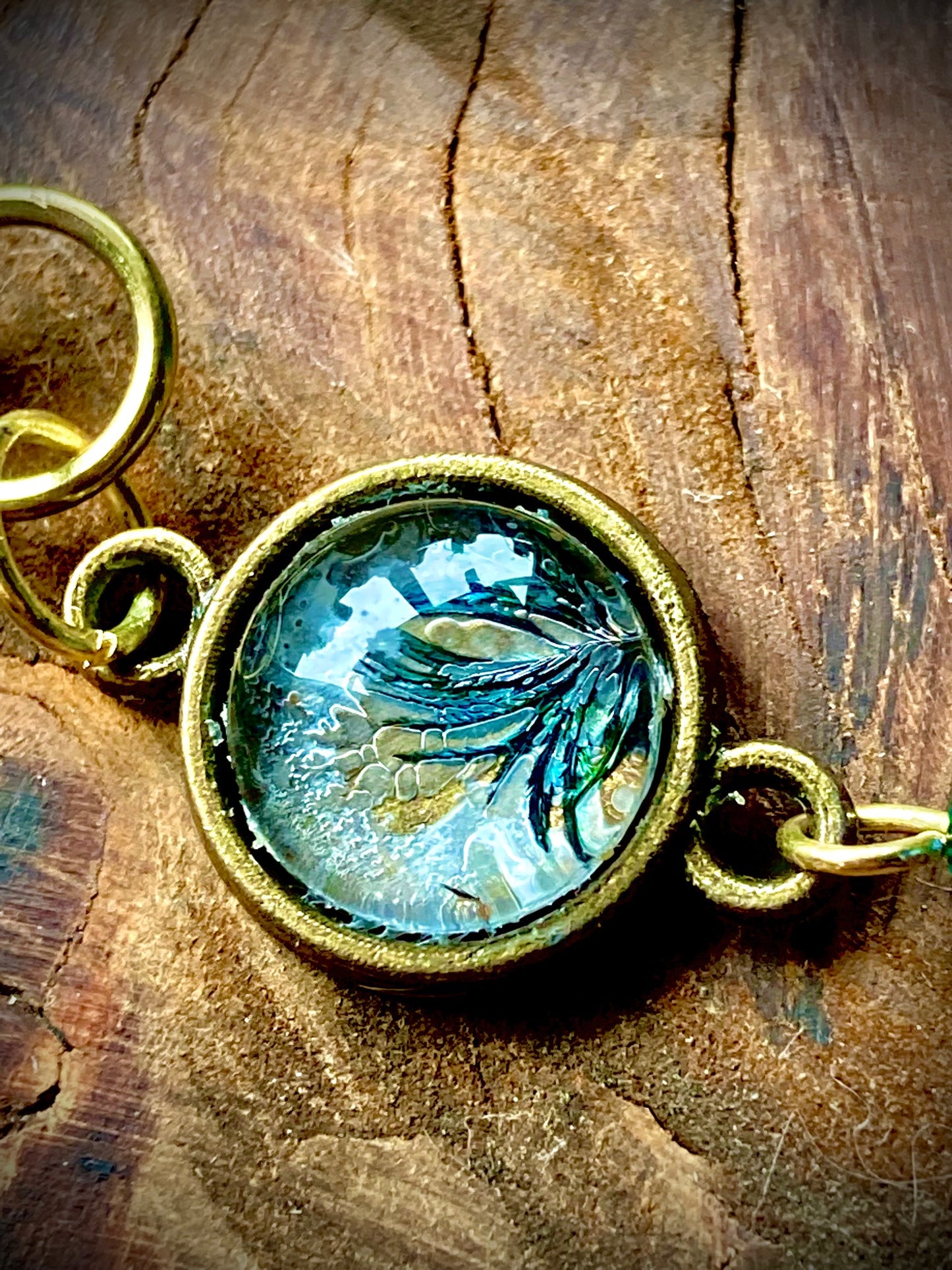 Dangling bronze feathers with unique hand crafted bead earrings