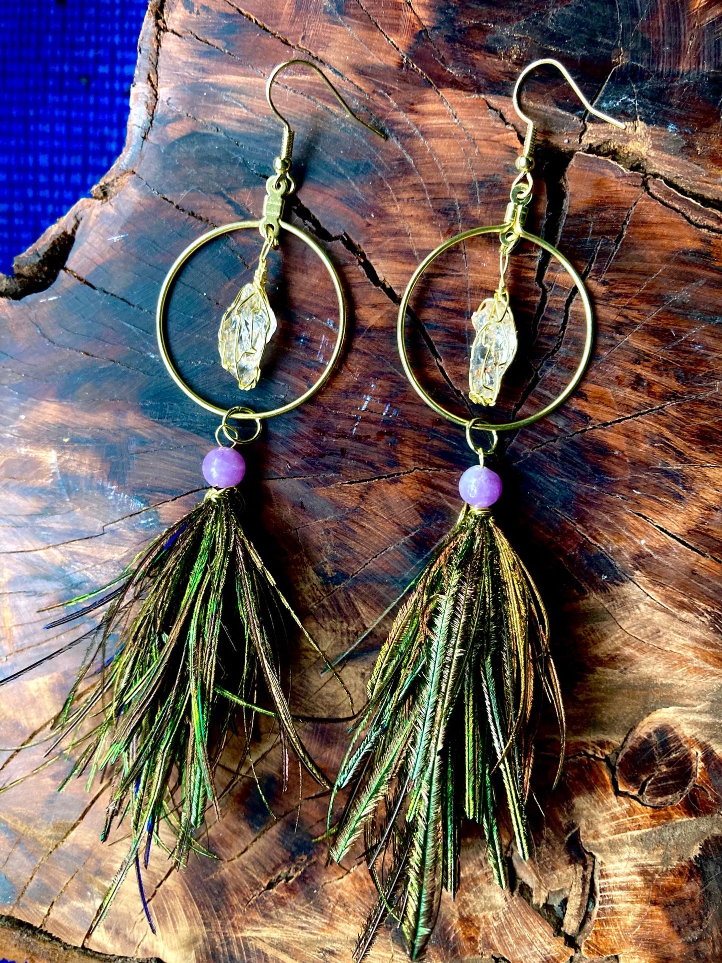 Gold circles with Northern California diamonds and pixy cut peapoofs with purple jade beads