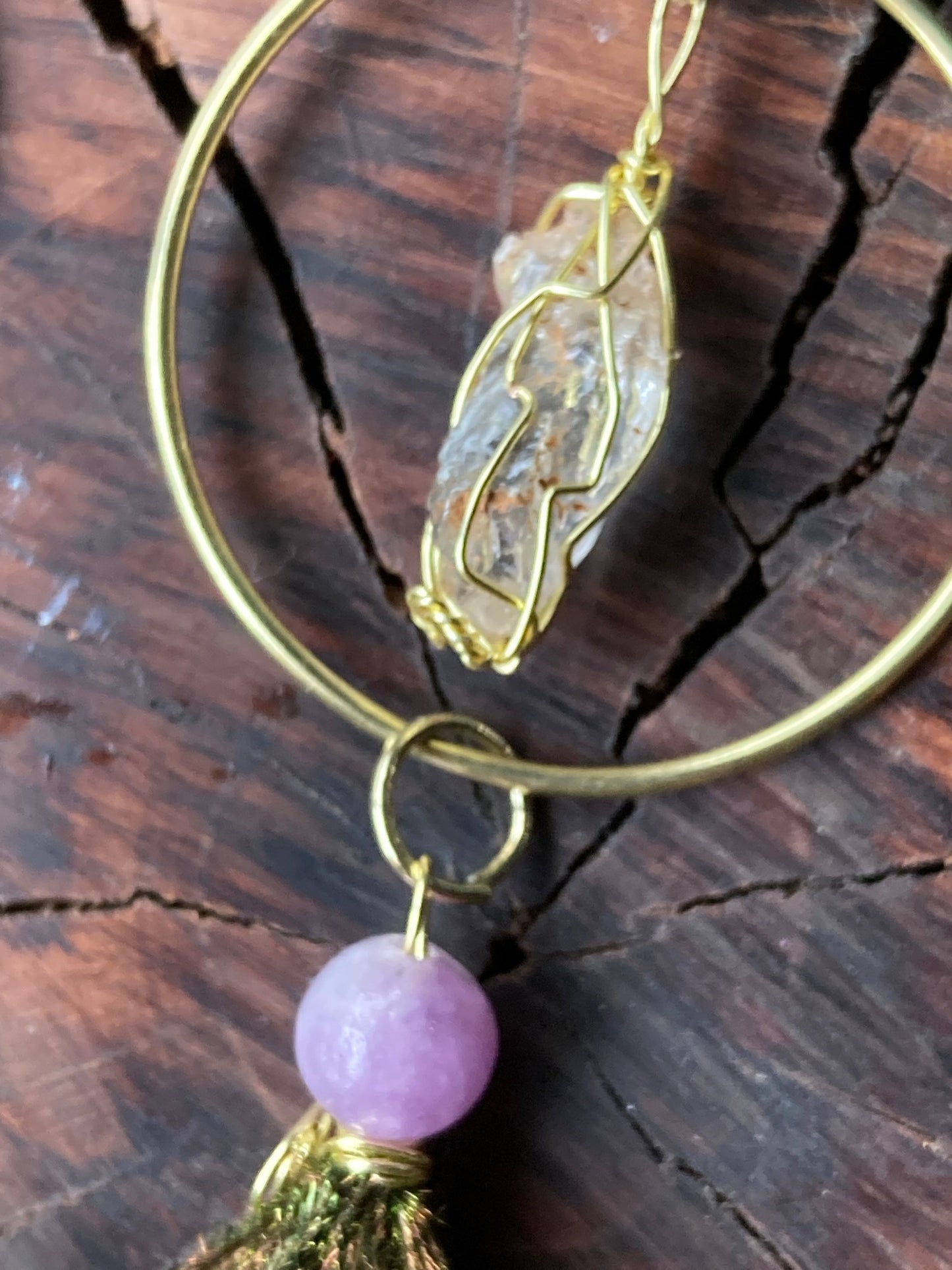 Gold circles with Northern California diamonds and pixy cut peapoofs with purple jade beads