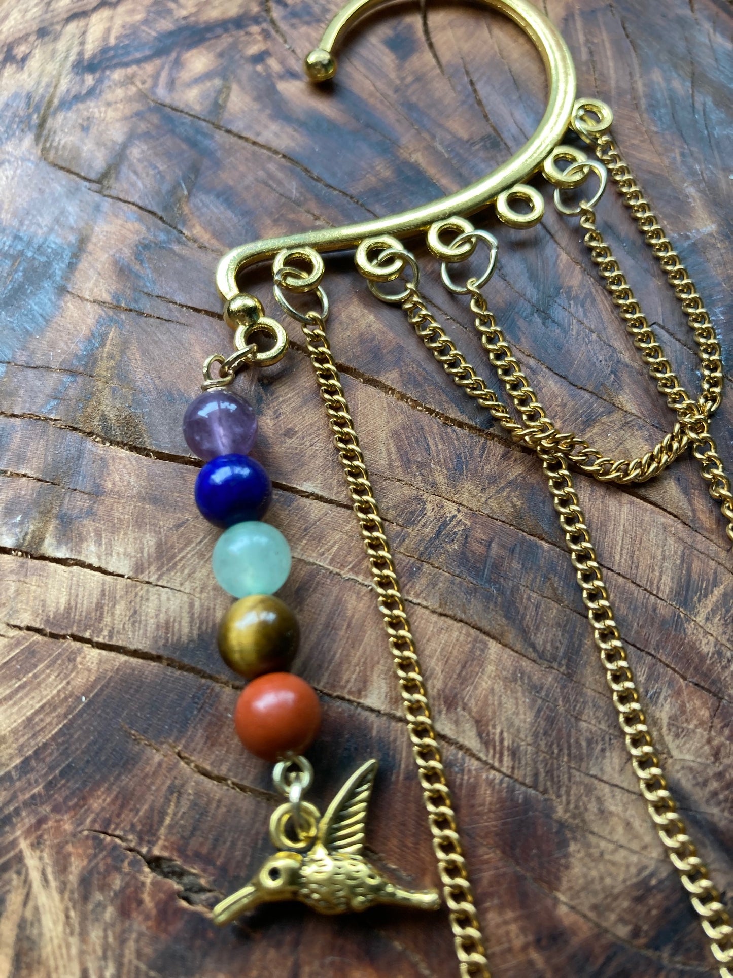 Earcuff single, swooping gold chain with rainbow beads and hummingbird