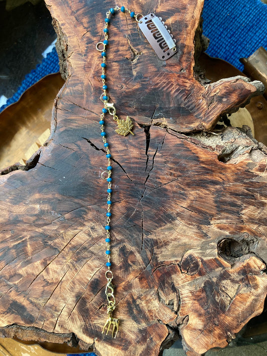 Hair charm dangle made of tanzanite beads with gold deer charm