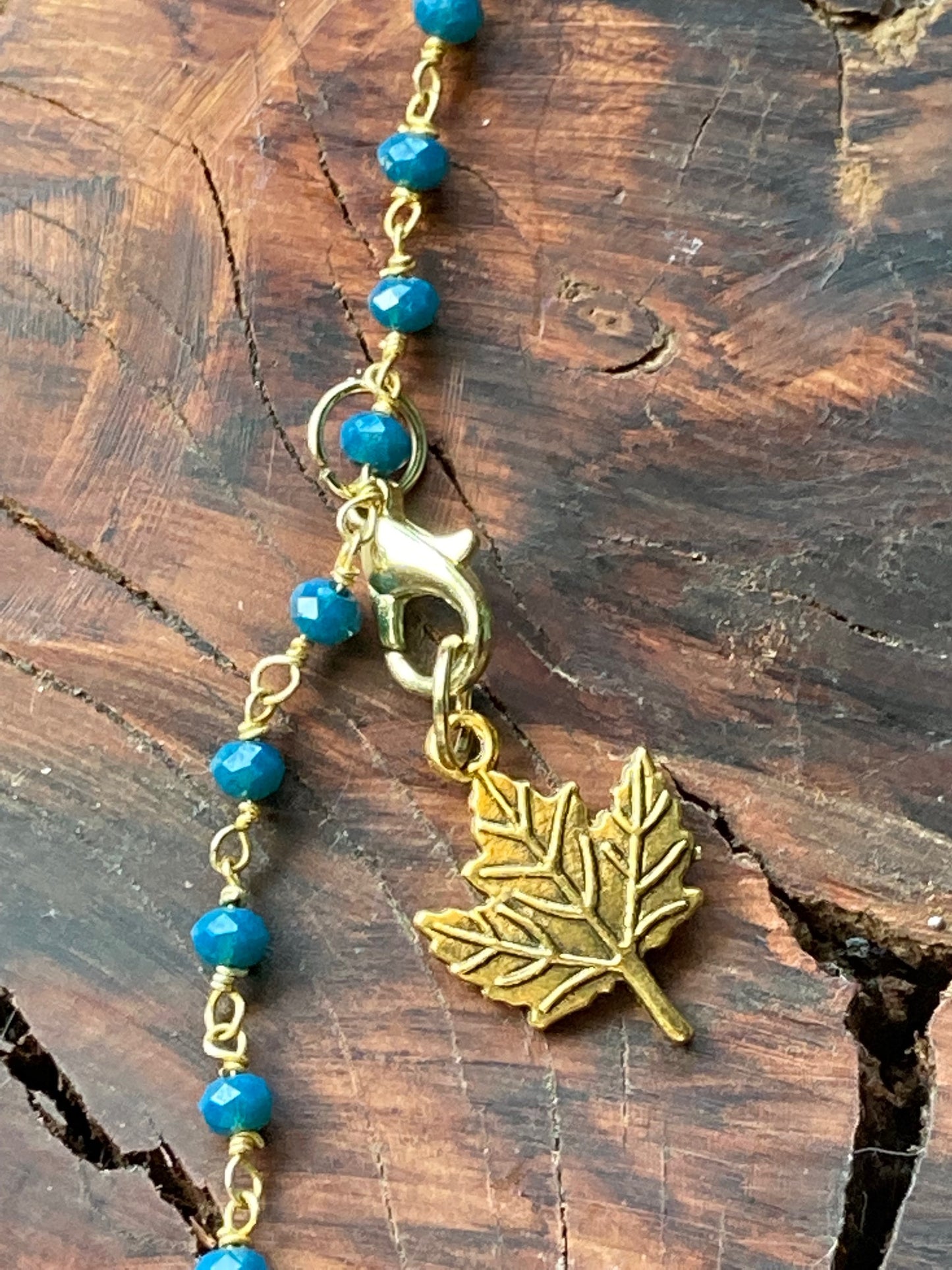 Hair charm dangle made of tanzanite beads with gold deer charm