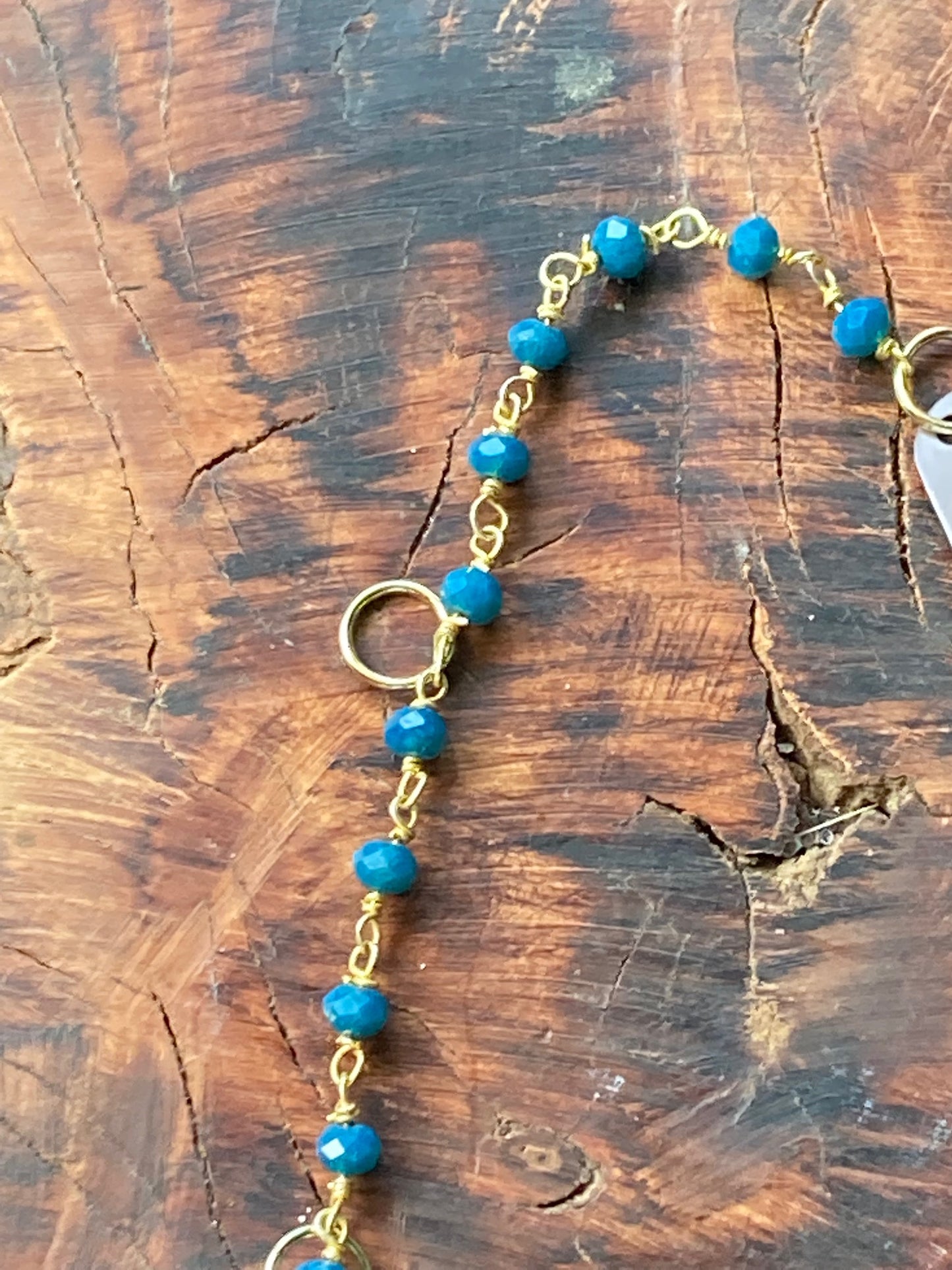 Hair charm dangle made of tanzanite beads with gold deer charm