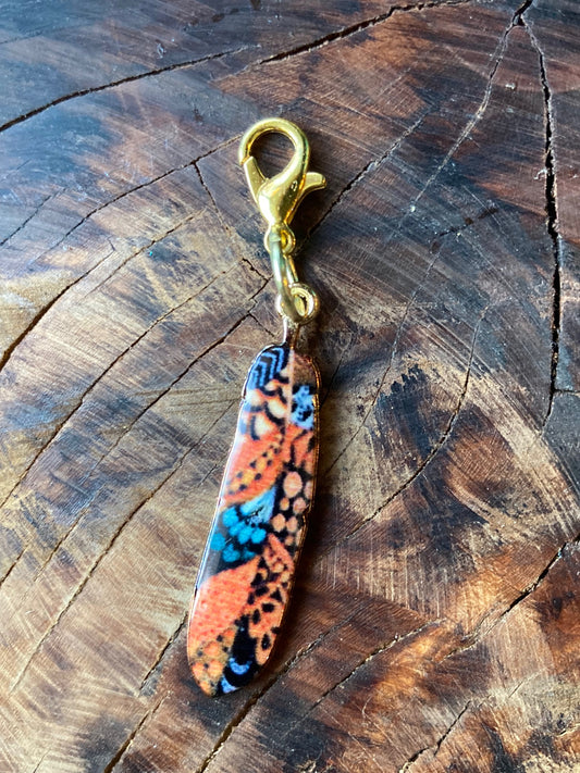 Enamel feather hook charm